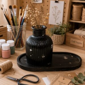 Black vintage ribbed vase with dried flowers